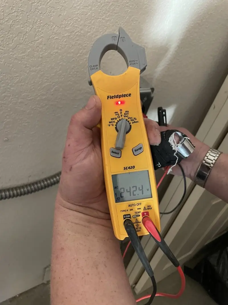 Voltage testing with clamp meter during Electrical Installation Services in Calumet City